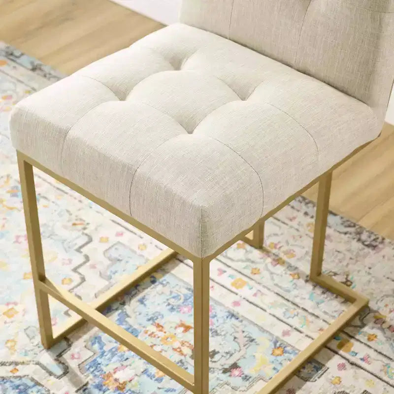 Sgabelli da bar imbottiti in tessuto color oro Privy ad altezza bancone